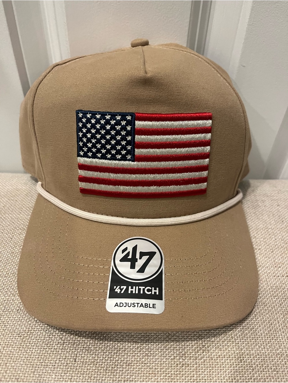NWT 47 HITCH MEN'S TAN HAT WITH AMERICAN FLAG PATCH- ONE SIZE